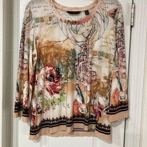 A blouse which looks like a city, streetlight and a cup of latte as the design.